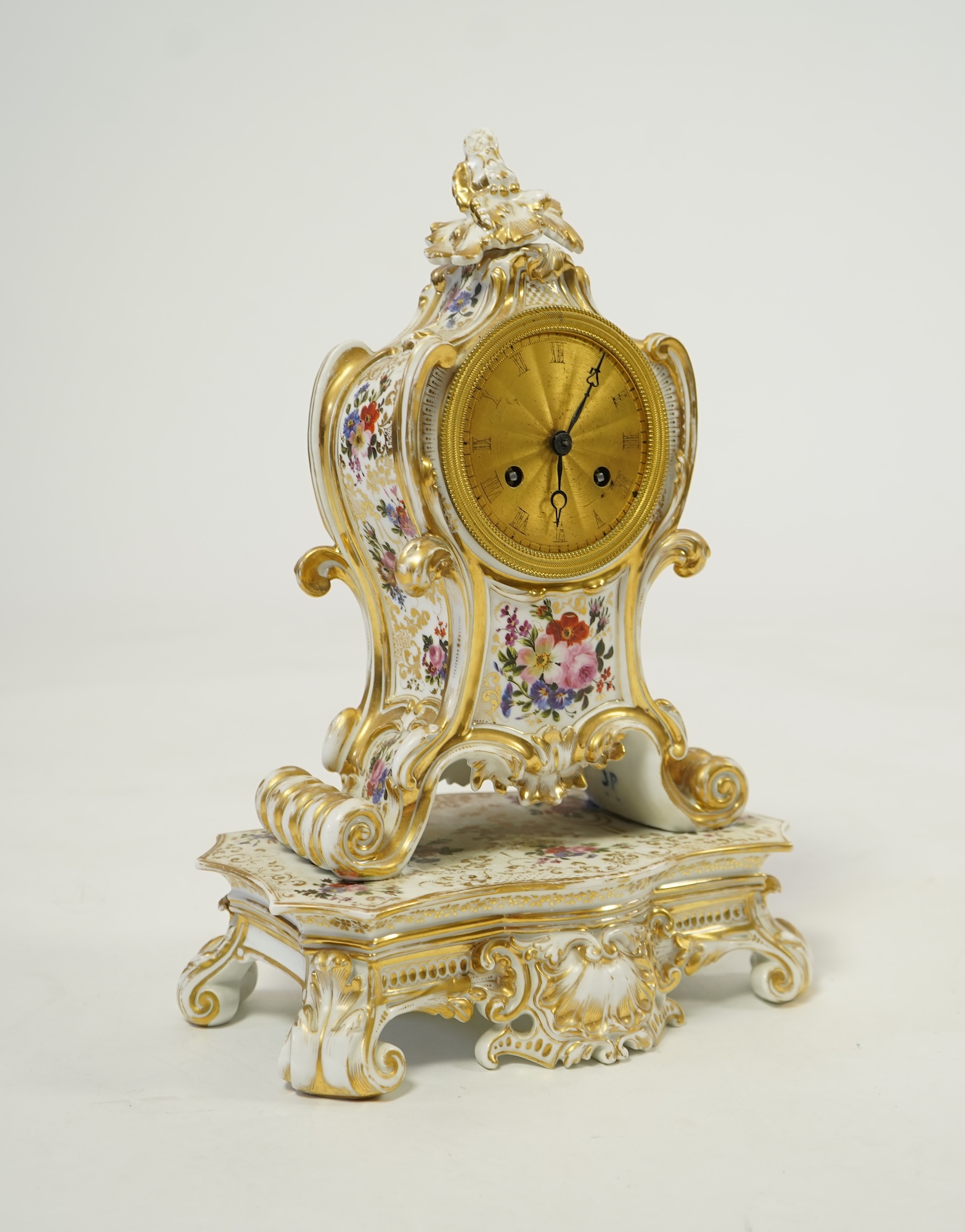 A mid 19th century French porcelain floral and gilt decorated clock, by Jacob Petit